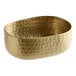 An American Metalcraft gold hammered aluminum oval bowl with a patterned design.