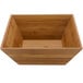 A square bamboo bowl with a white liner inside.