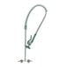 A T&S stainless steel wall mounted pre-rinse faucet with a hose.