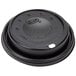 A black plastic Dart travel lid with a hole.