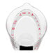 An OXO clear plastic measuring cup with red measuring labels.