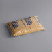 A bag of Nabisco Graham Cracker Crumbs on a gray surface.