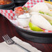 a tacos and limes on a checkered tablecloth