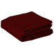a close-up of a folded red blanket