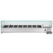 An Avantco refrigerated countertop prep rail with a glass sneeze guard.