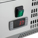A close-up of the temperature control panel of an Avantco Countertop Refrigerated Prep Rail.