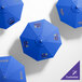 A customized California Umbrella with a silver pole and Pacific Blue Sunbrella canopy.