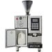 An Astra Super Mega I automatic coffee machine with a white jug of milk.