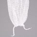 A white mesh bag with a string hanging from it.