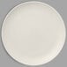 A RAK Porcelain white flat coupe plate on a white surface.