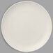 A RAK Porcelain Sand White coupe plate on a white surface.