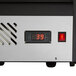 The digital thermometer and clock on an Avantco refrigerated countertop bakery display case.