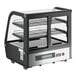 An Avantco black refrigerated countertop bakery display case with glass doors and LED lighting.