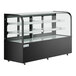 An Avantco black glass refrigerated bakery display case on a counter with glass shelves.