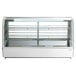 A white refrigerated countertop display case with shelves.