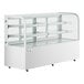 A white Avantco dry bakery display case with curved glass shelves.