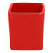 A stack of ember red RAK Porcelain ramekins.