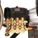 close-up of a black machine with gold colored bolts