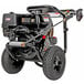 A Simpson gas powered black pressure washer with a Honda engine and wheels with a 50' hose.
