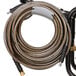 The coiled hose of a Simpson Powershot pressure washer on a white background.