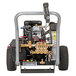 A Simpson water pressure washer with a hose attached.