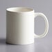 An Acopa ivory stoneware mug with a C-handle.