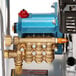 The Simpson Aluminum Series pressure washer with a hose attached to it.