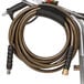 A Simpson pressure washer hose attached to a tube.