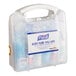 A Purell body fluid spill kit in a clear clamshell case with a handle.