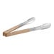 Two Vollrath stainless steel tongs with tan Kool-Touch handles.