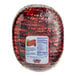 A large round Kunzler Black Forest Honey Turkey Ham with a label.