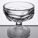 a clear glass bowl on a table