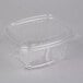 A Genpak clear plastic deli container with a high dome lid.