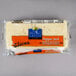 a package of cheese on a gray surface