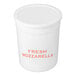 A white tub of fresh mozzarella Ovoline balls.
