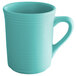 A close up of a Tuxton Concentrix Island Blue mug with a handle.