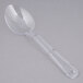 A Thunder Group clear polycarbonate salad bar spoon with a handle.