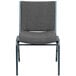 A gray Flash Furniture stack chair with a metal frame and gray fabric.