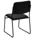 A Flash Furniture black vinyl banquet chair with metal legs.