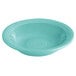 A blue bowl with a white circular rim.