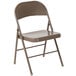 A beige metal folding chair.