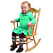 A child sitting in a Whitney Brothers child's rocking chair.