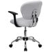 A white office chair with black armrests and a chrome base.