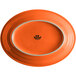 An orange oval Tuxton china platter with a white border.