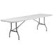 A Flash Furniture rectangular white plastic folding table with metal legs.