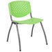 A green plastic Flash Furniture stack chair with metal legs.