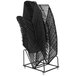 A metal rack holding a stack of black Flash Furniture stack chairs.