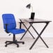 A Flash Furniture blue office chair with armrests next to a laptop on a table.