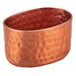 An American Metalcraft copper bowl with a textured surface and a hole in it.