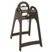 A Koala Kare brown high chair with a tray on a wooden stand.